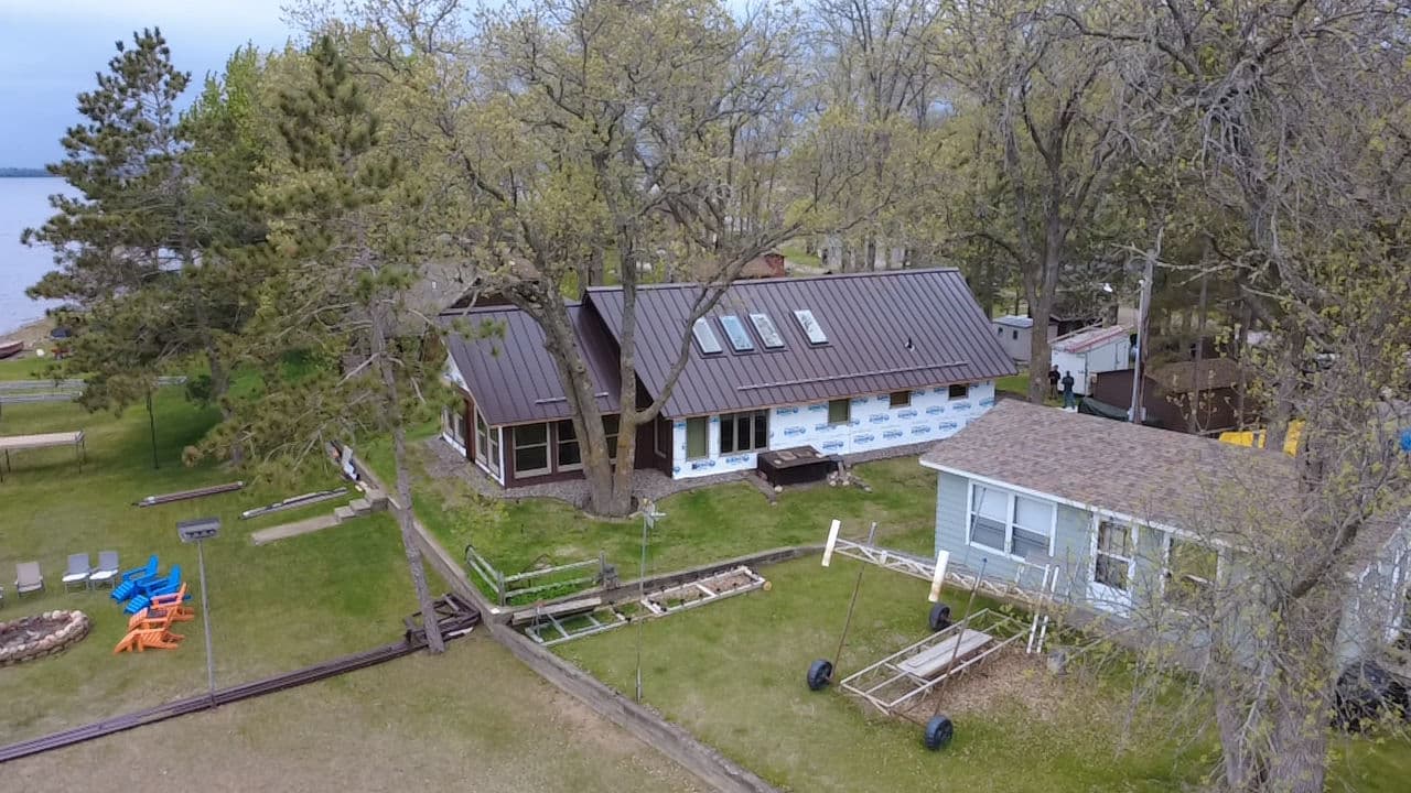Project 24-Gauge Mechanically Seamed Metal Roof on a Lakeside Home image