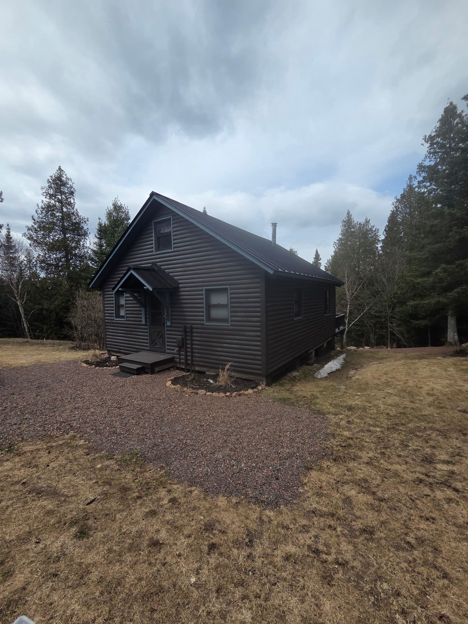 Project 24-Gauge Mechanical Seam Metal Roofing on a Cabin in the Woods image