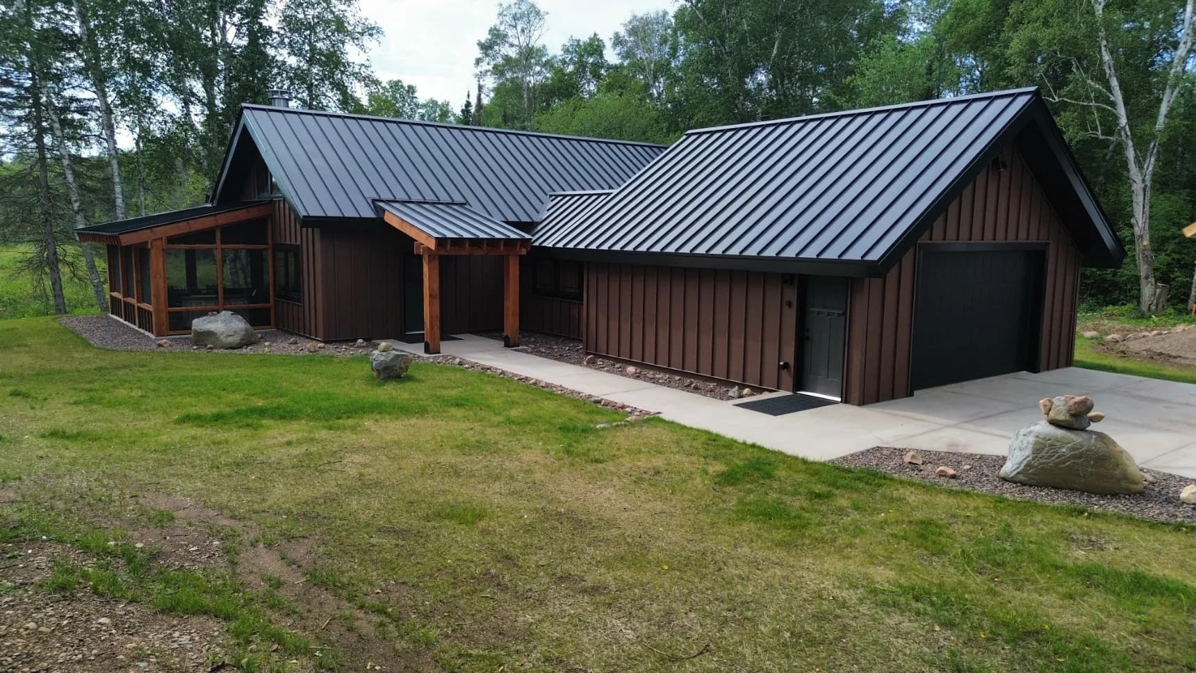 24-Gauge Deep Black Metal Roof Meets Western Rust Steel Siding image
