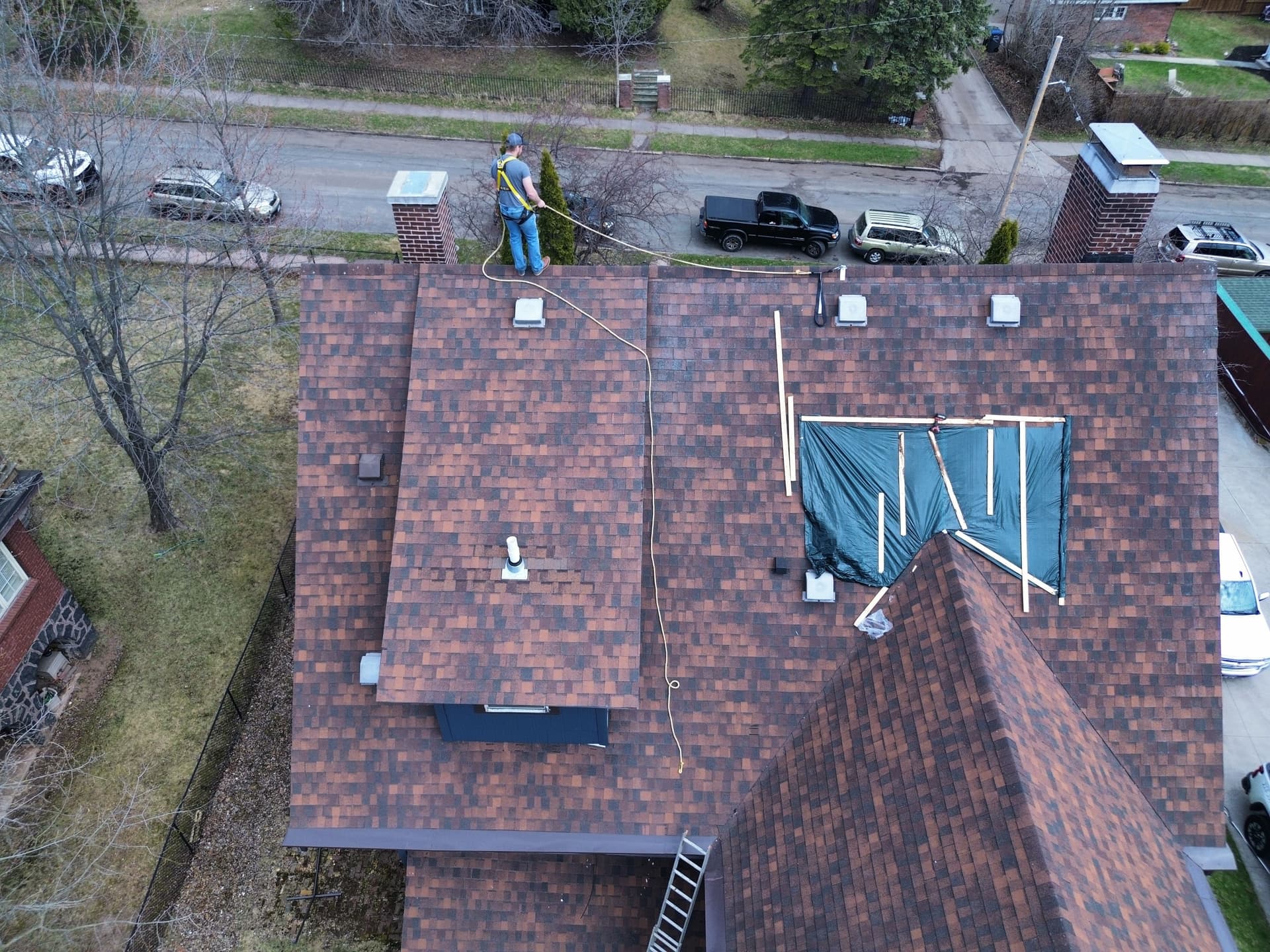 Storm Damage Roof Patch and Tarp Before Full Metal Roof Replacement image