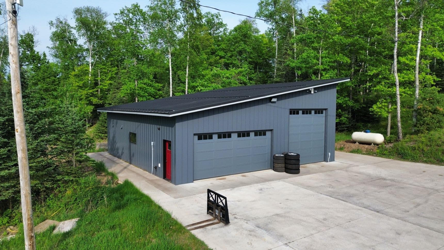 Project Modern Sleek Garage with On-Site Metal Roofing image